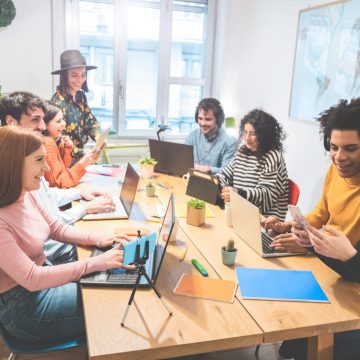 Young co-workers team talking during startup - Happy people planning a new project in creative coworking office - Technology, entrepreneur, marketing concept - Focus on left girl face with red hair Are We Ready for the Next Generations? A Look at Gen Alpha and Beta