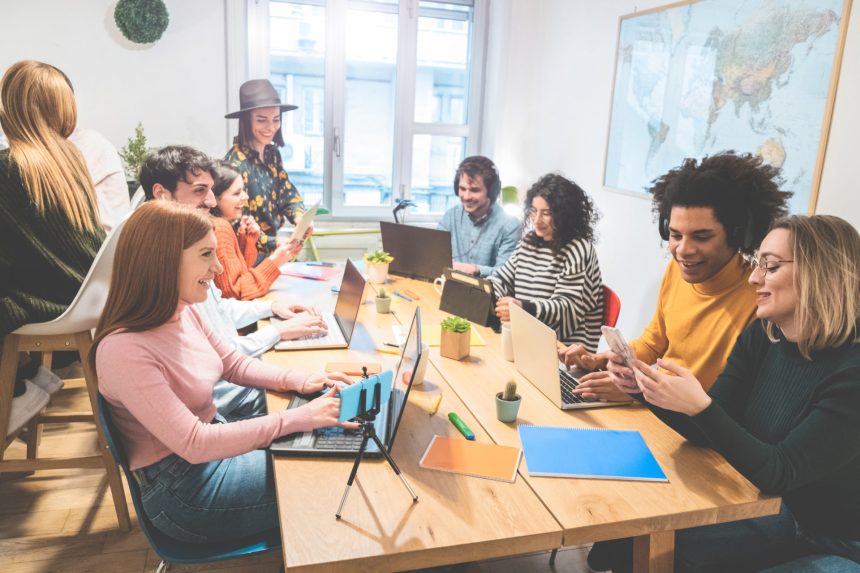 Young co-workers team talking during startup - Happy people planning a new project in creative coworking office - Technology, entrepreneur, marketing concept - Focus on left girl face with red hair Are We Ready for the Next Generations? A Look at Gen Alpha and Beta